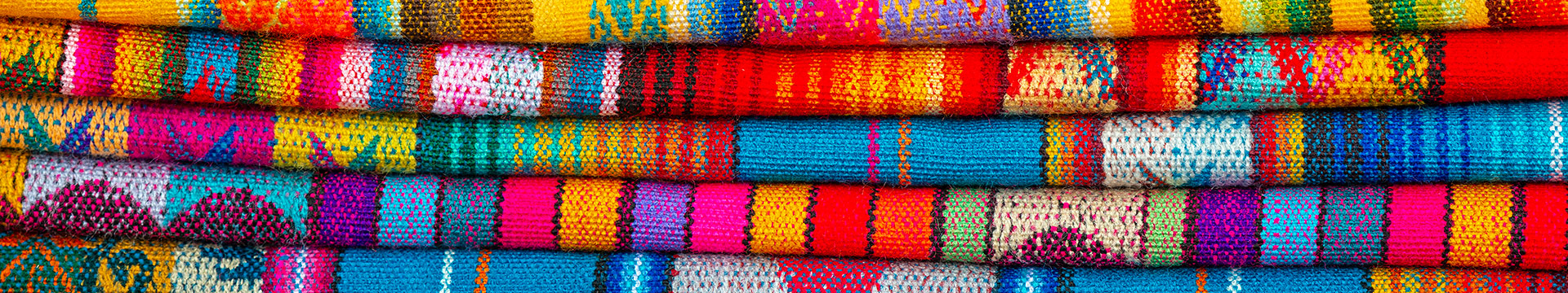 Otavalo market colorful fabrics